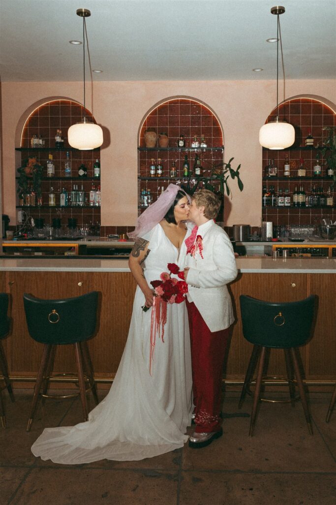An lgbtq couple share a kiss at The Pink Lantern Birmingham at their elopement styled shoot 