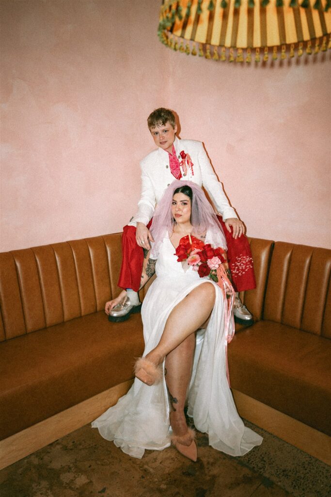 Vintage Vegas–style elopement portraits of a couple in colorful wedding outfits at The Pink Lantern in Birmingham 