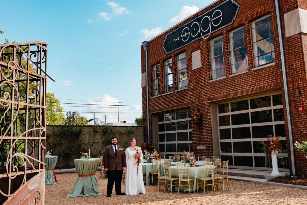 A bridal portrait taken in The Sage courtyard against blue skies in Birmingham, AL