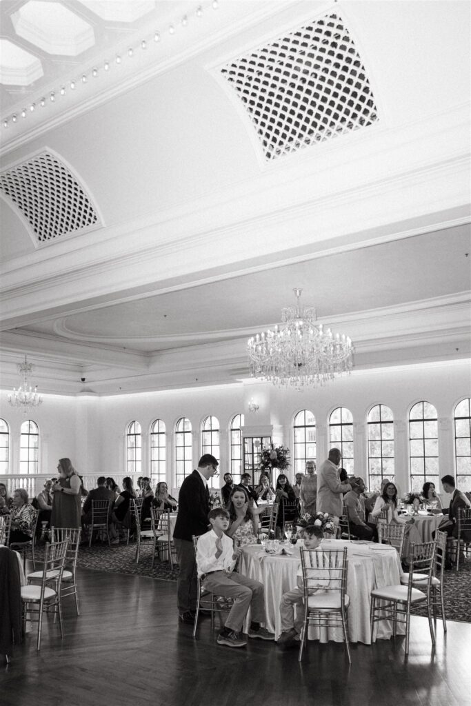 Guests enjoy a reception held at The Florentine in Birmingham AL in a black and white photo