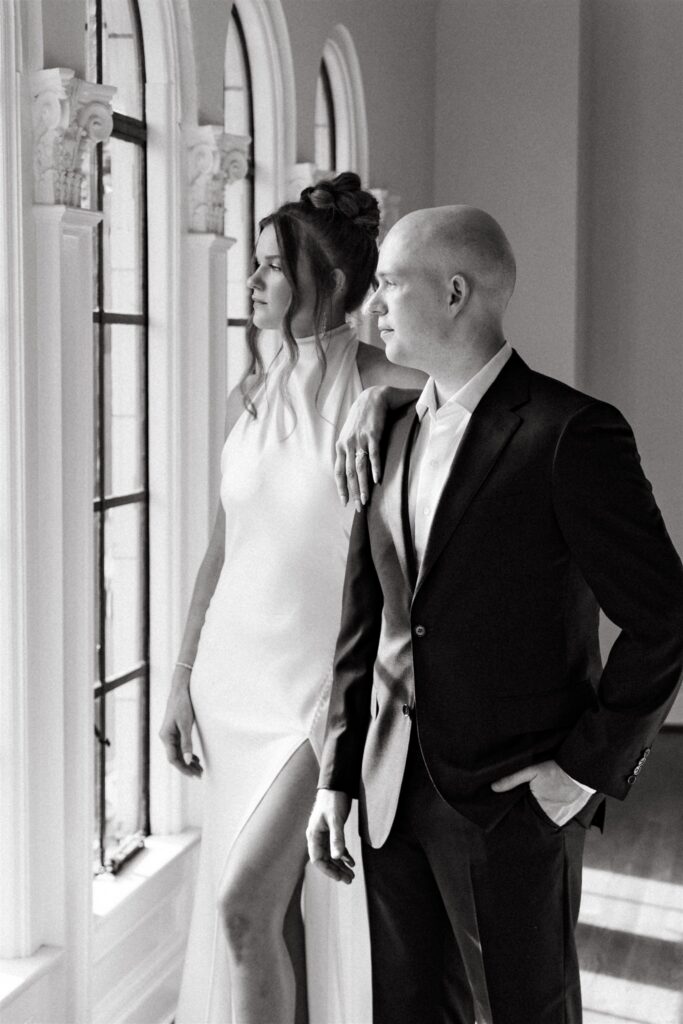 A black and white portrait shows a bride & groom at their reception held at a Birmingham wedding venue 