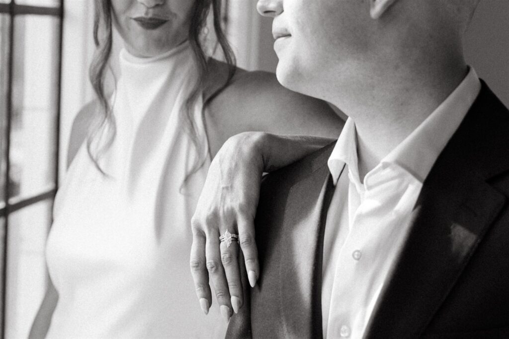 A black and white editorial style photo showcases a close up image of a bride and groom at The Florentine in Birmingham AL