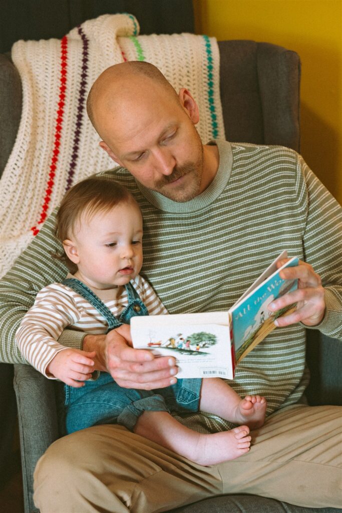 A father reads to his son during family portraits birmingham al
