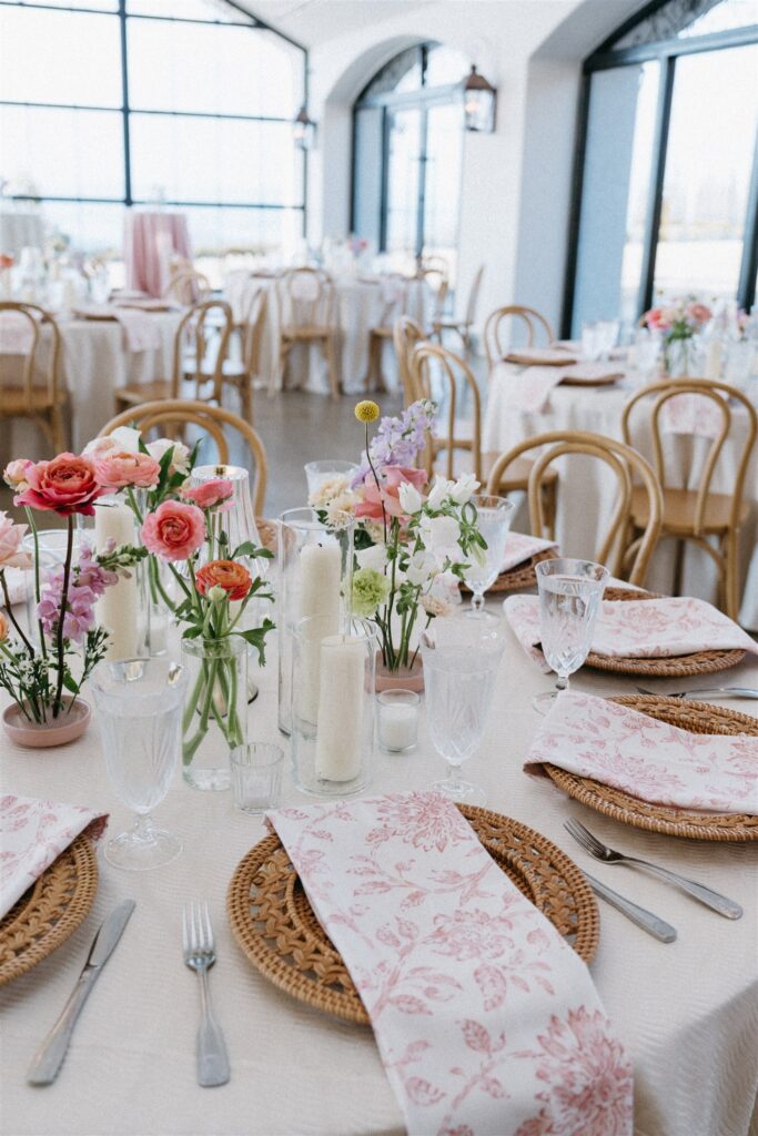 A colorful floral inspired reception is photographed at Stone Haven Events, a popular venue for weddings in Alabama 