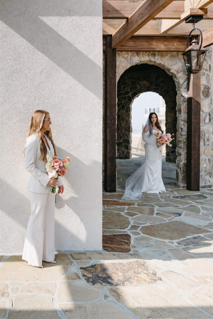 A first look between two Alabama brides is captured at Stone Haven, a Section Alabama wedding venue