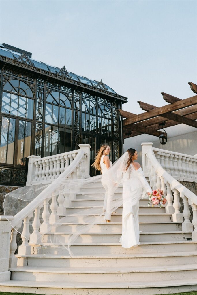Brides walk up the steps to The Atrium at a Section Alabama wedding venue 