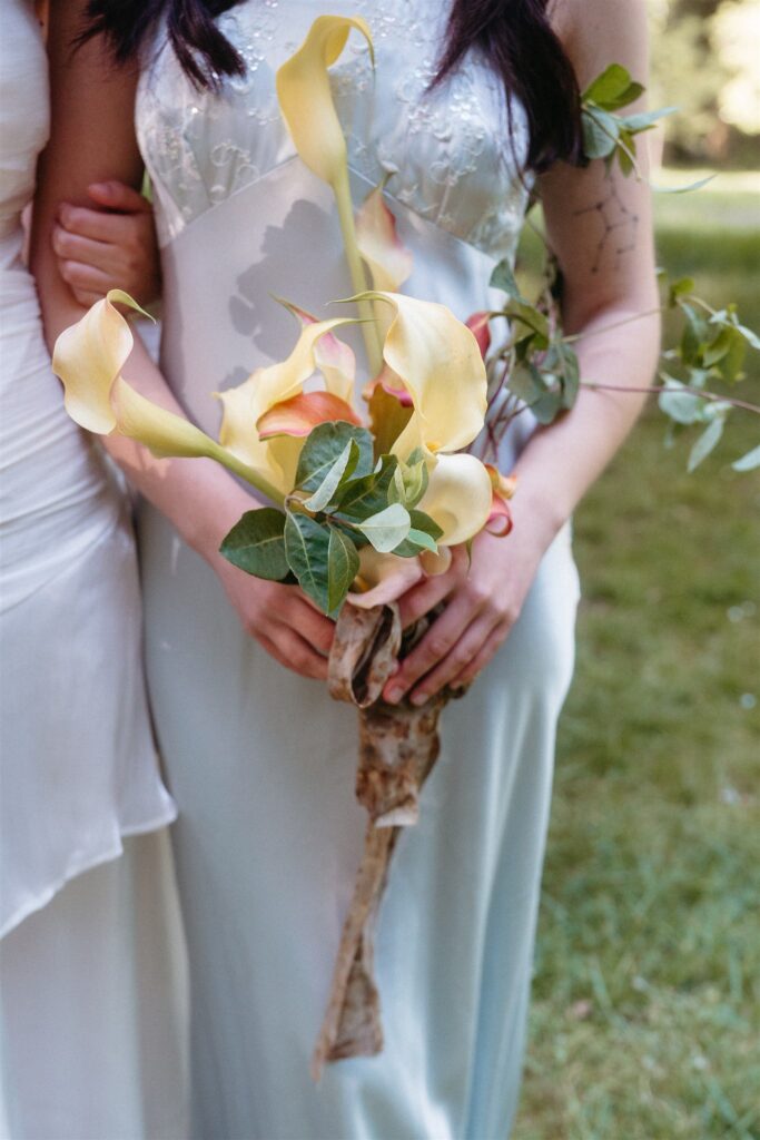 Oregon coast elopement bouquet with calla lilies and greenery