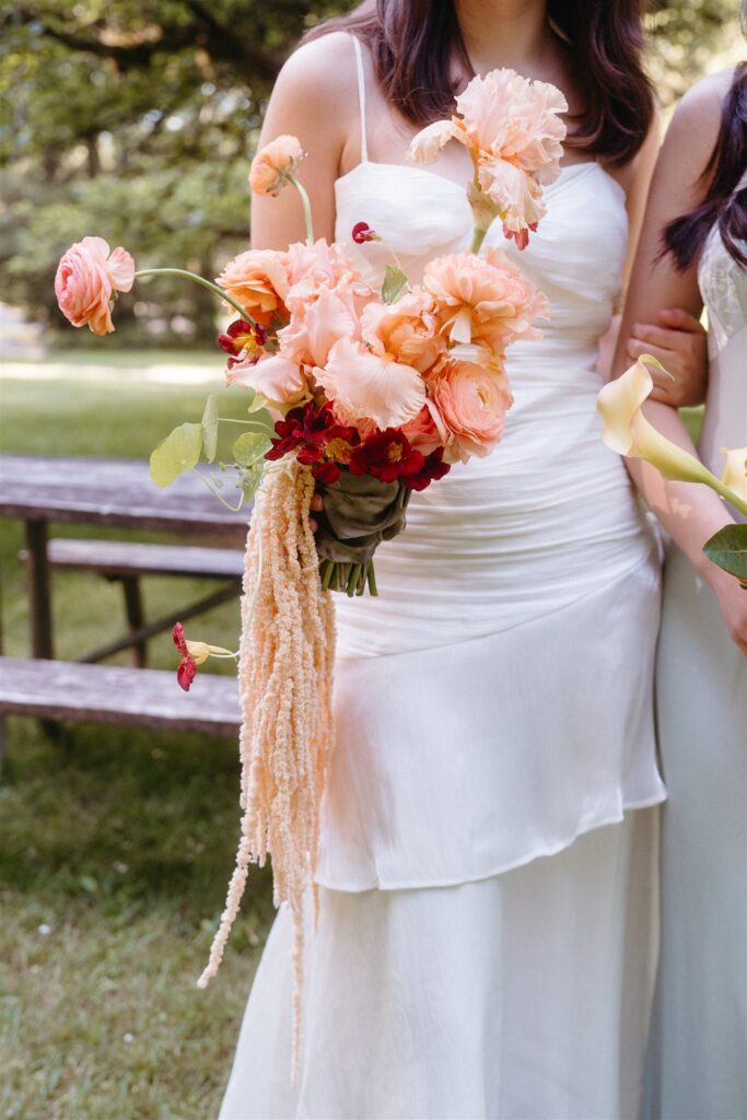 Colorful florals in shades of peach and coral for a bridal bouquet for a bride eloping in Oregon