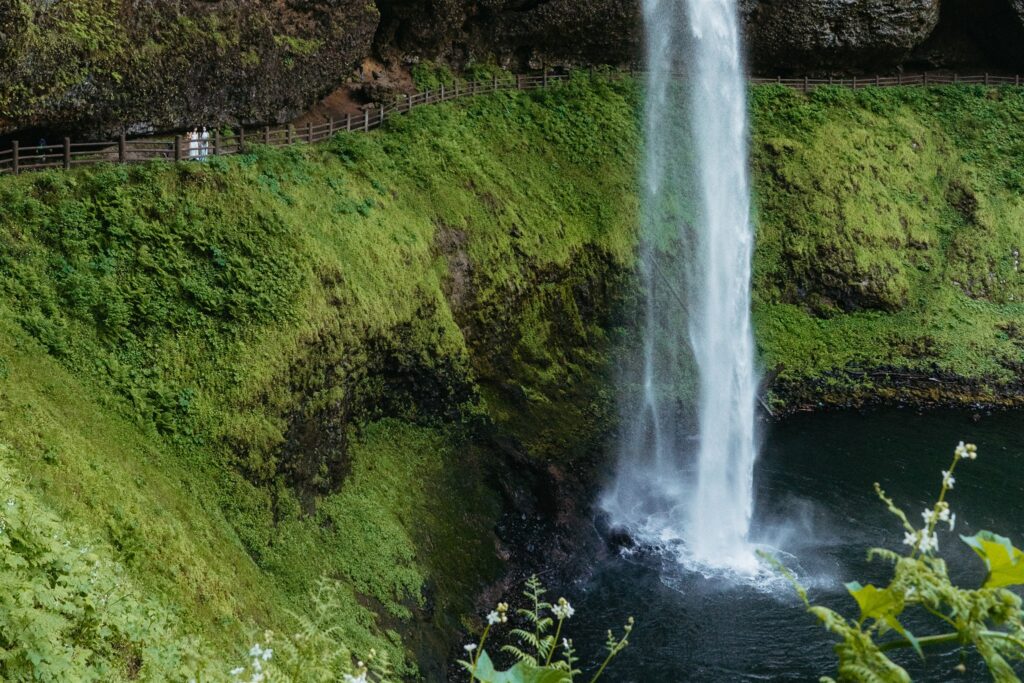 A water fall is photographed at a silver falls oregon wedding